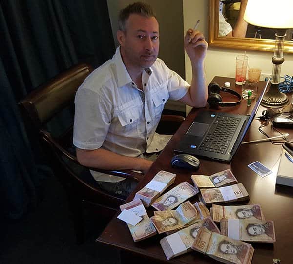 Jeff Berwick with 100 dollars in Bolivars - The Dollar Vigilante